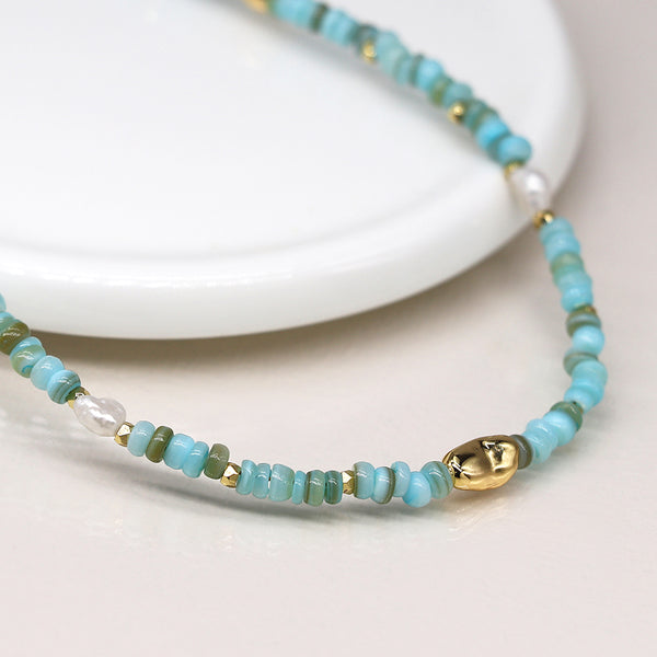 04308 Mixed aqua blue, pearl and faux gold bead necklace