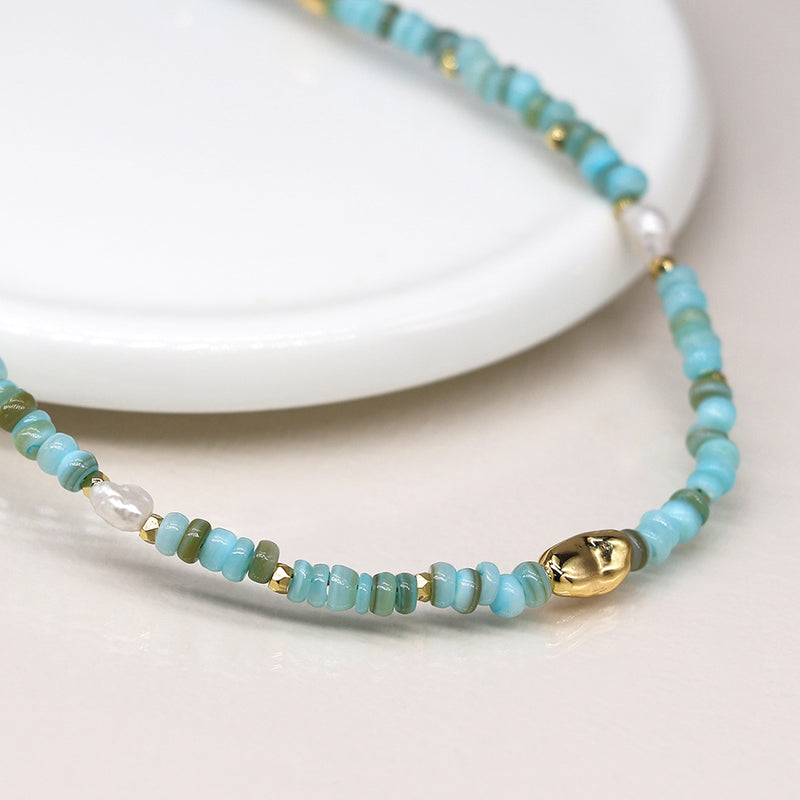 04308 Mixed aqua blue, pearl and faux gold bead necklace